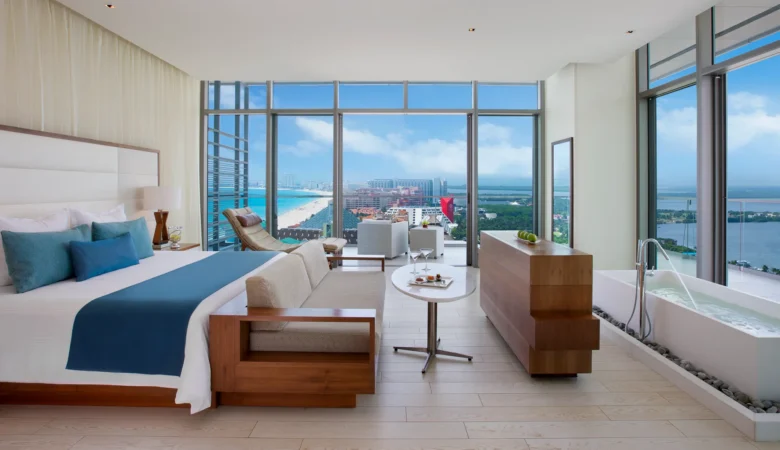 Honeymoon Suite Ocean View with private balcony and panoramic Caribbean views at Secrets The Vine Cancun.