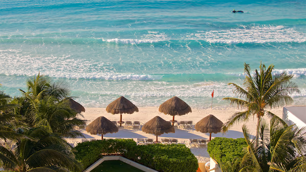 Hotel Zone beaches near Secrets The Vine Cancun with white sand shoreline and vibrant Caribbean waters