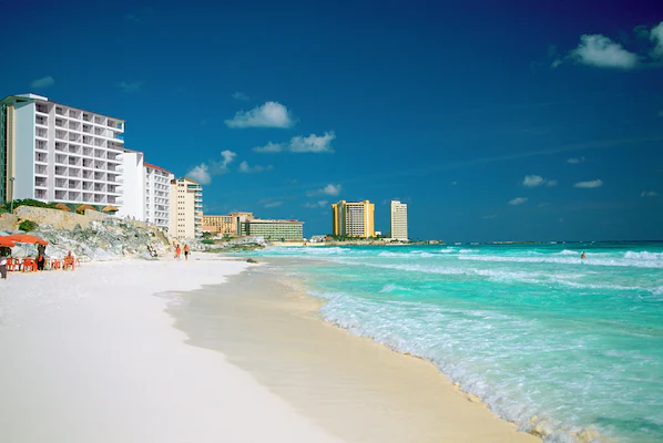 Marlin Beach near Secrets The Vine Cancun with expansive white sand and clear turquoise Caribbean waters