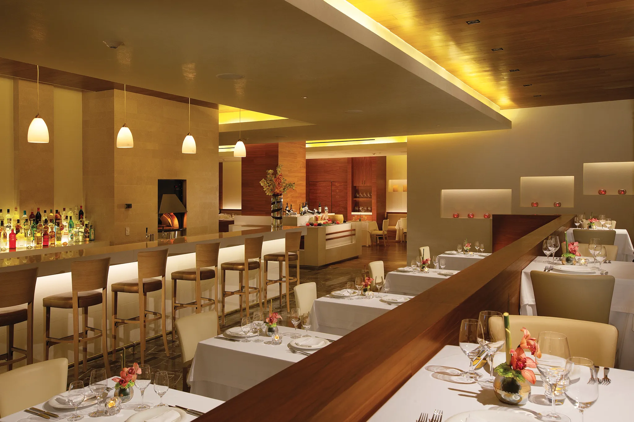 Nebbiolo Ristorante at Secrets The Vine Cancun featuring elegant indoor and outdoor dining with Italian specialties and stone-oven pizza.