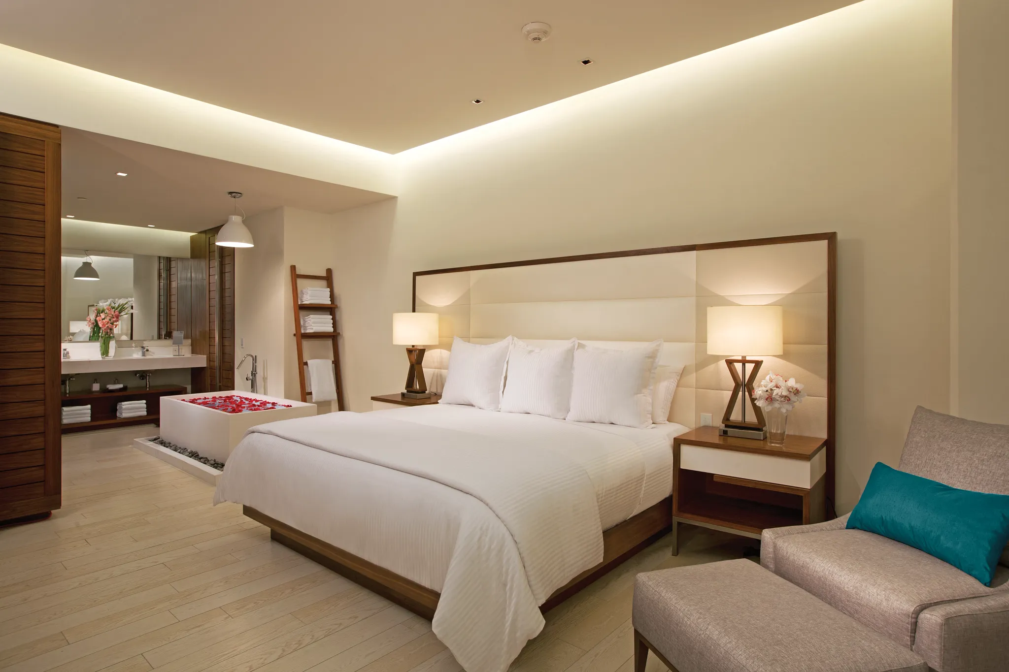 Preferred Club Governor Suite bedroom with king bed, soaking tub, and modern bathroom at Secrets The Vine Cancun.