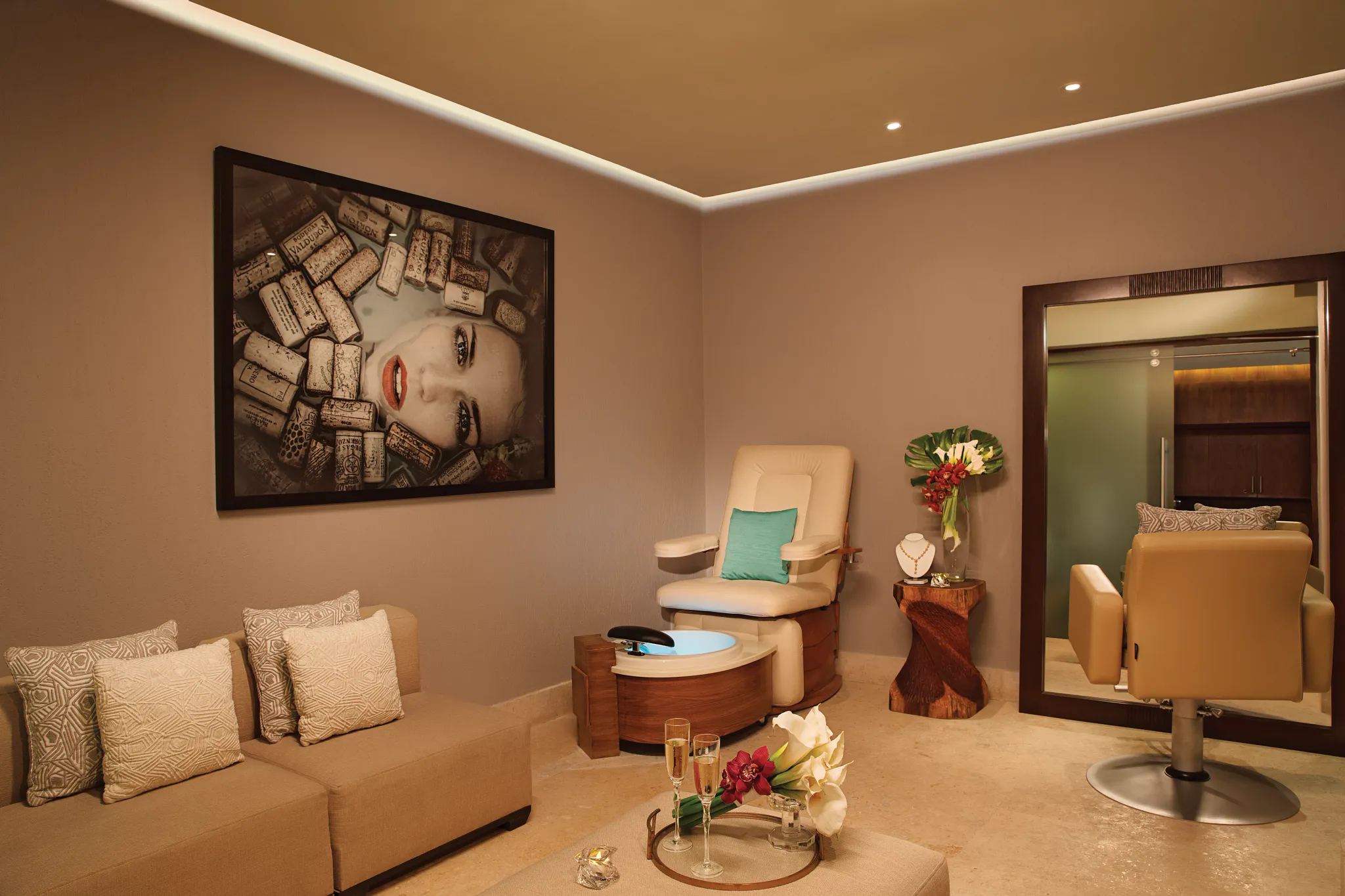 Spa bridal suite with vanity mirror, flowers, and relaxation chair at Secrets The Vine Cancun.